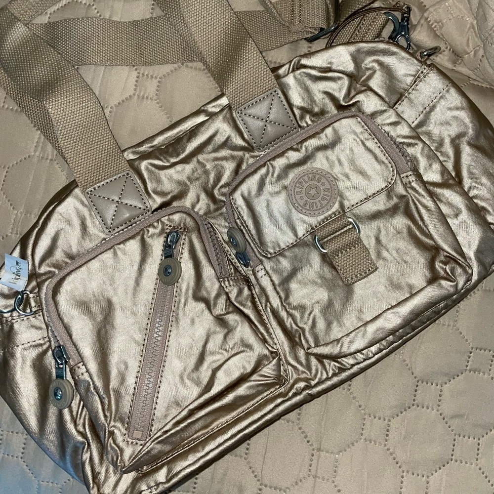 Kipling Defea with detachable, adjustable, swivel crossbody strap.